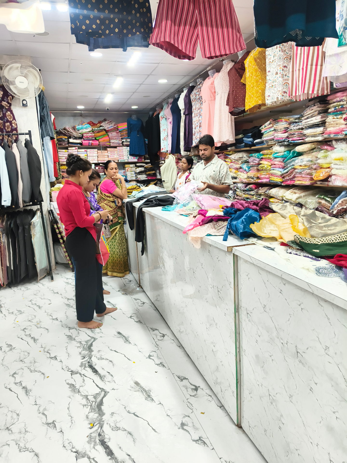 Customers exploring the shopping experience inside Fashion Street